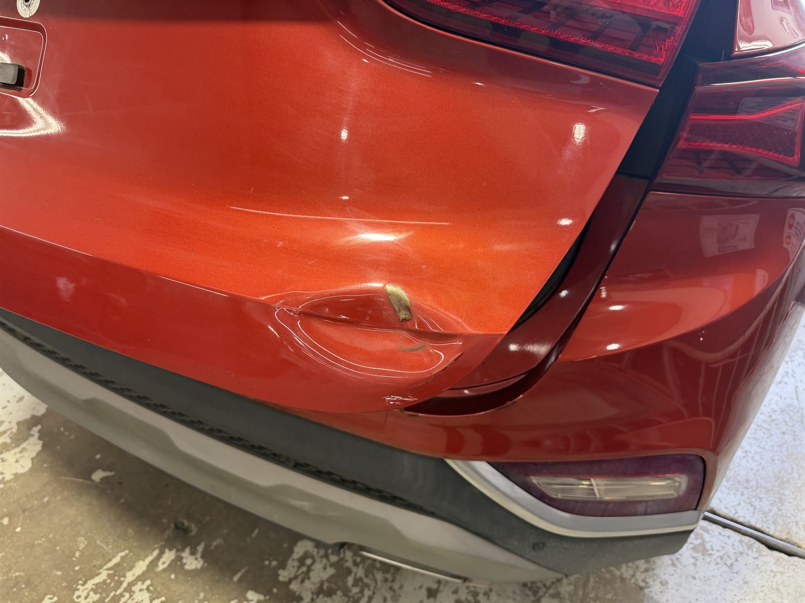 Hyundai Santa Fe dented tailgate before repair